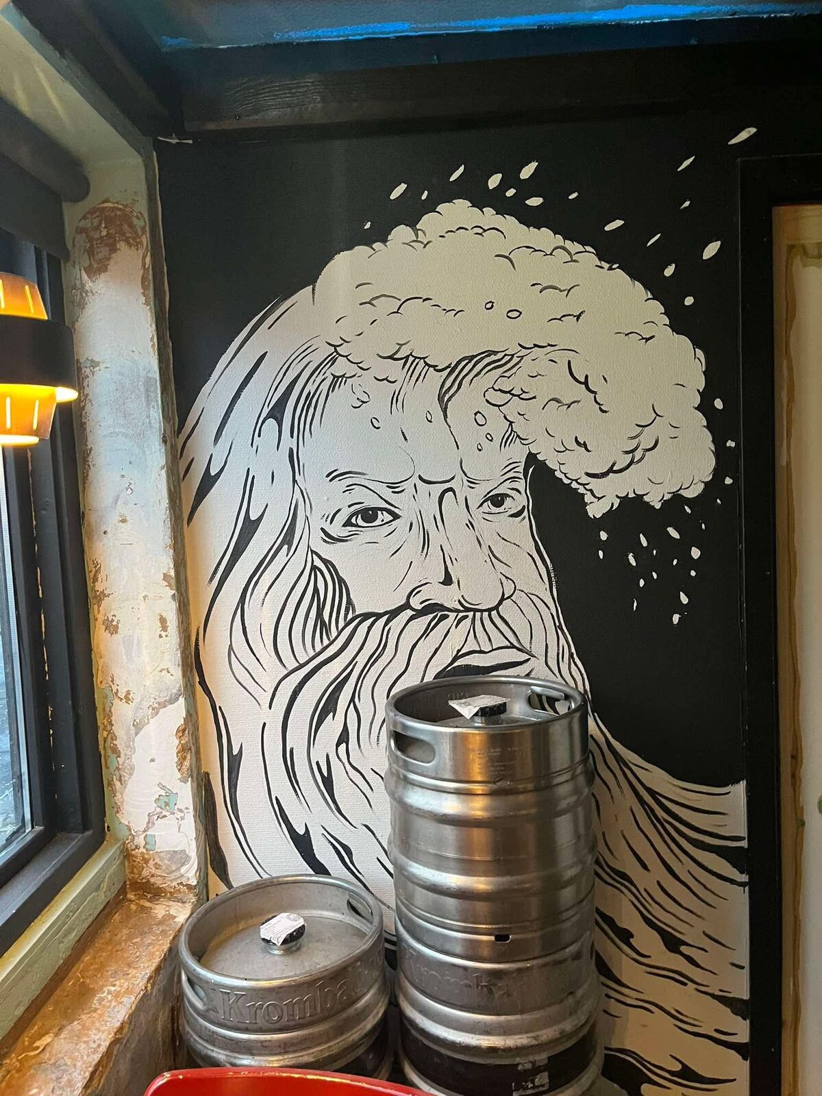 The ÆGIR mural and kegs inside the taproom