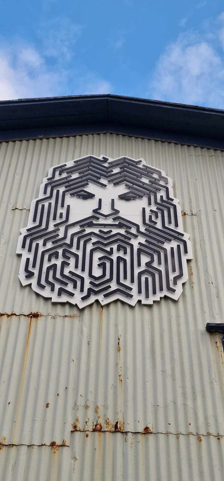 The ÆGIR mark on the corrugated facade of ÆGIR 220