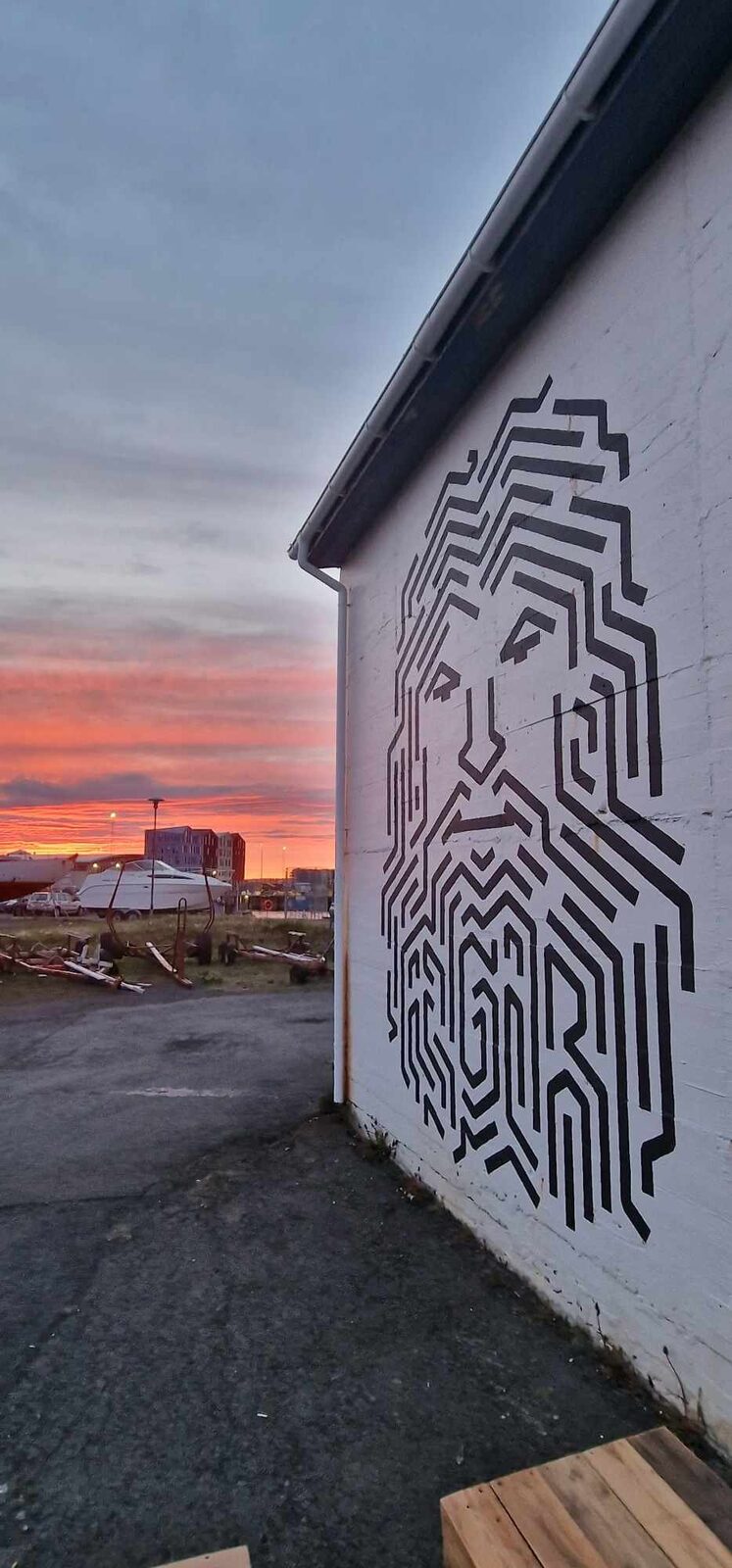 The ÆGIR mural at sunset in Hafnarfjörður